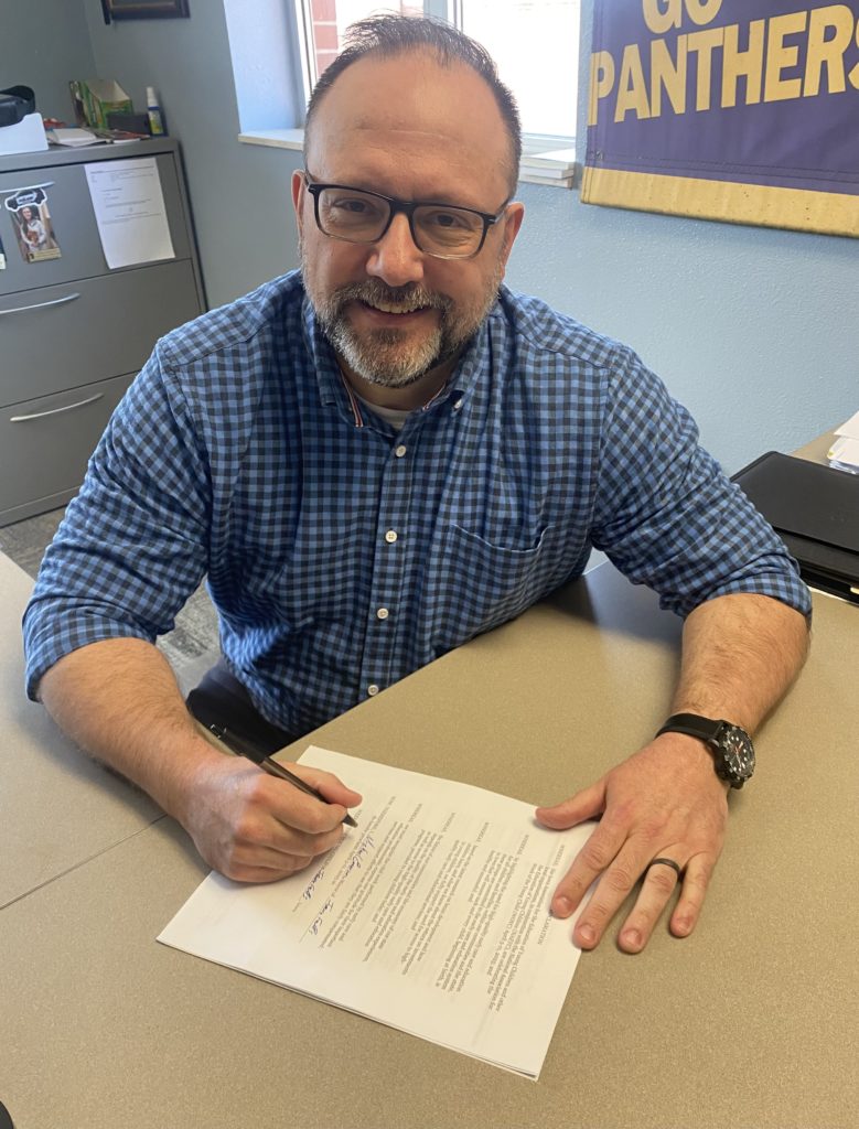 Mayor Michael Emerson signing WOYC proclamation